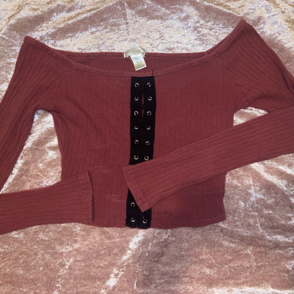 Small maroon, cropped, off the shoulder shirt.